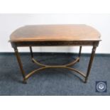 A shaped walnut side table with understretcher with reeded legs CONDITION REPORT: