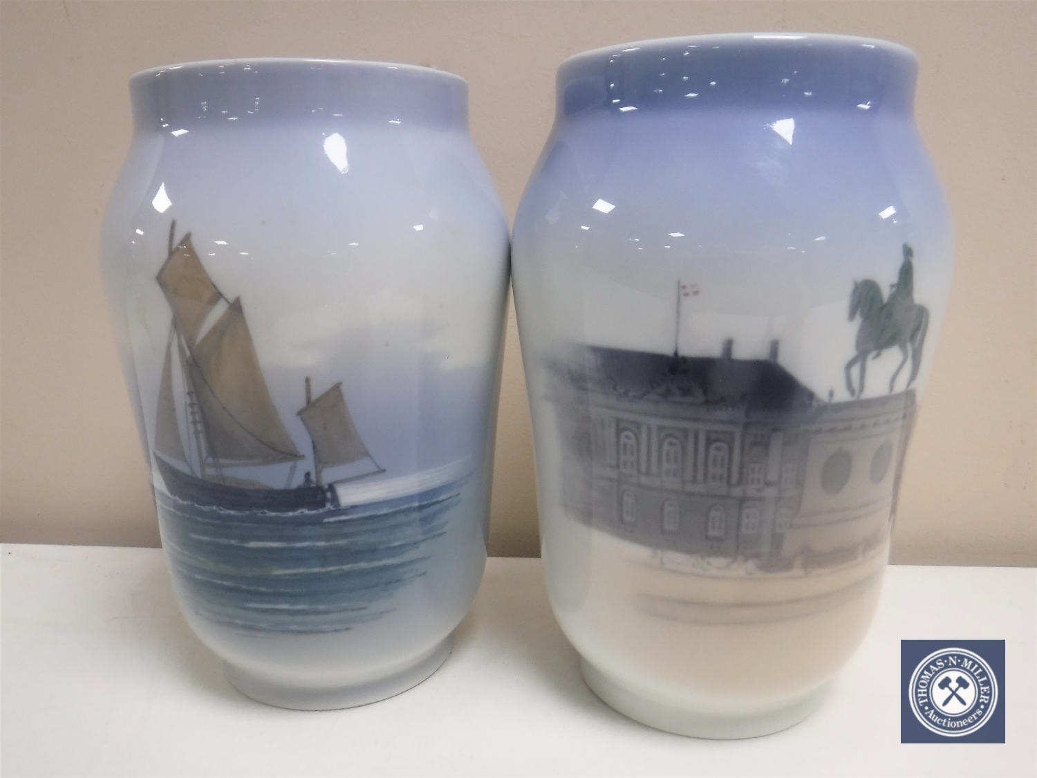 Two Royal Copenhagen vases depicting a sailing boat and a town hall,