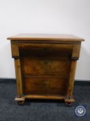 A continental inlaid mahogany three drawer chest