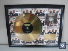 A framed Bee Gees Saturday Night Fever 24ct gold plated disc, limited edition number 15/1500.