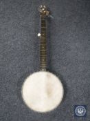 An Ajax open back five string banjo