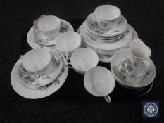 A tray of twenty-one piece antique Royal Doulton tea service decorated with flowers