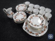 A tray of thirty-four pieces of Victorian tea china