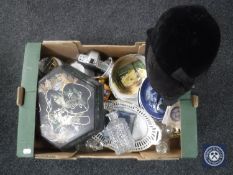 A box of assorted china, oriental wall plate and lidded box, glass decanter, two riding hats etc.