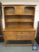 An early 20th century oak kitchen dresser,