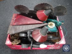 A box of metal Art Deco style light shades, cast iron candle sconces, vintage style telephone,