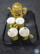 A Ringtons Heritage teapot together with four matching mugs