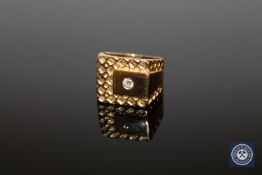 An 18ct yellow gold diamond set signet ring, the brilliant-cut diamond weighing approximately 0.