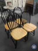 A set of four pine seated kitchen chairs