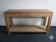 A Barker and Stonehouse side table fitted with three drawers