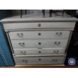 A continental oak painted five drawer chest with brass handles