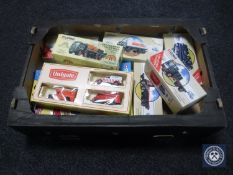 A box of boxed die cast delivery vehicles,