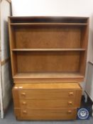 A twentieth century teak three drawer chest together with a set of open bookshelves