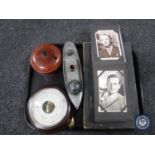 A tray of circular Bakelite cased barometer, Lattaque board game, wooden roulette wheel,