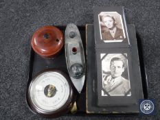 A tray of circular Bakelite cased barometer, Lattaque board game, wooden roulette wheel,