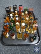 A tray of approximately 35 whisky miniatures