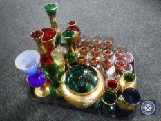 A tray of coloured glass, hand painted vases, together with eleven coloured liqueur glasses,