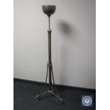 An antique brass rise and fall standard lamp base