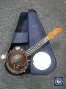 A John Gray banjolele in case (missing vellum and tuning pegs)