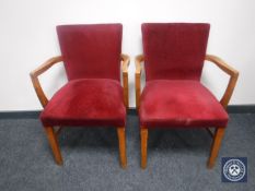 A pair of mid twentieth century armchairs upholstered in red dralon