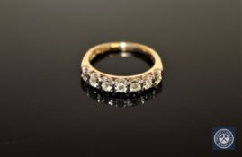 An 18ct gold seven stone diamond half-eternity ring,