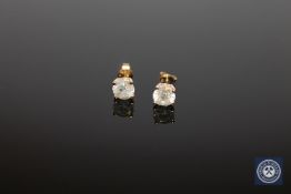 A pair of 14ct yellow gold diamond stud earrings, the two brilliant-cut diamonds weighing 1.
