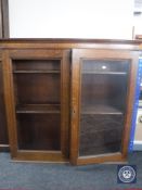 An antique oak double door bookcase top