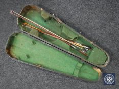 An antique violin coffin case together with three violin bows