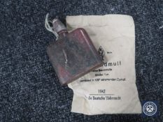 A WWII flask together with a packet of WWII German dressing