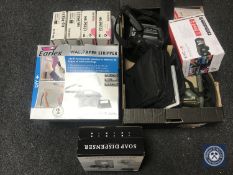 A box of virtual reality head set together with a wall paper stripper and four Aiwa stereo cassette