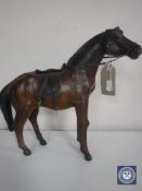 A miniature leather horse