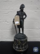 A reproduction bronze figure of a general with sword on marble base