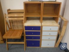 A set of four folding kitchen chairs together with two pine four drawer chests and two pine two