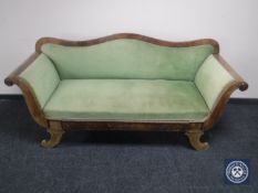 A 19th century continental mahogany framed scroll arm settee