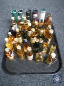 A tray of approximately 35 whisky miniatures