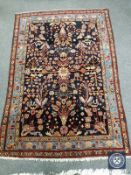 An antique Persian Faraghan rug,