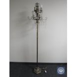 A contemporary metal standard lamp