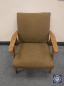 A mid twentieth century teak armchair