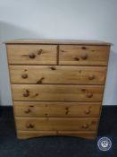 A contemporary pine six drawer chest