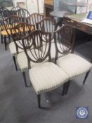 A set of six mahogany shield backed dining chairs