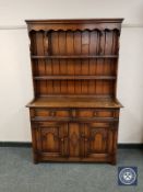 A reproduction oak miniature dresser,