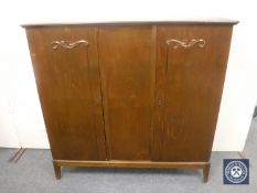 A continental walnut double door sideboard