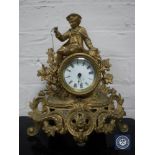 A nineteenth century continental gilt metal mounted mantel clock with enamel dial