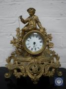 A nineteenth century continental gilt metal mounted mantel clock with enamel dial