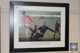 A colour photograph depicting Ron "Chopper" Harris and George Best,