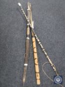 Two tribal bows together with a quiver of arrows