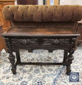 A 19th century carved oak side table fitted two drawers,