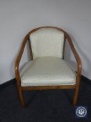 A pine framed tub chair upholstered in contemporary fabric