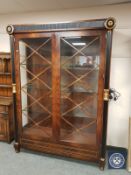 A fine quality glazed and illuminated Empire style display cabinet,