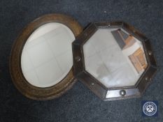 An Edwardian oak octagonal framed bevelled mirror together with an Edwardian oak carved mirror
